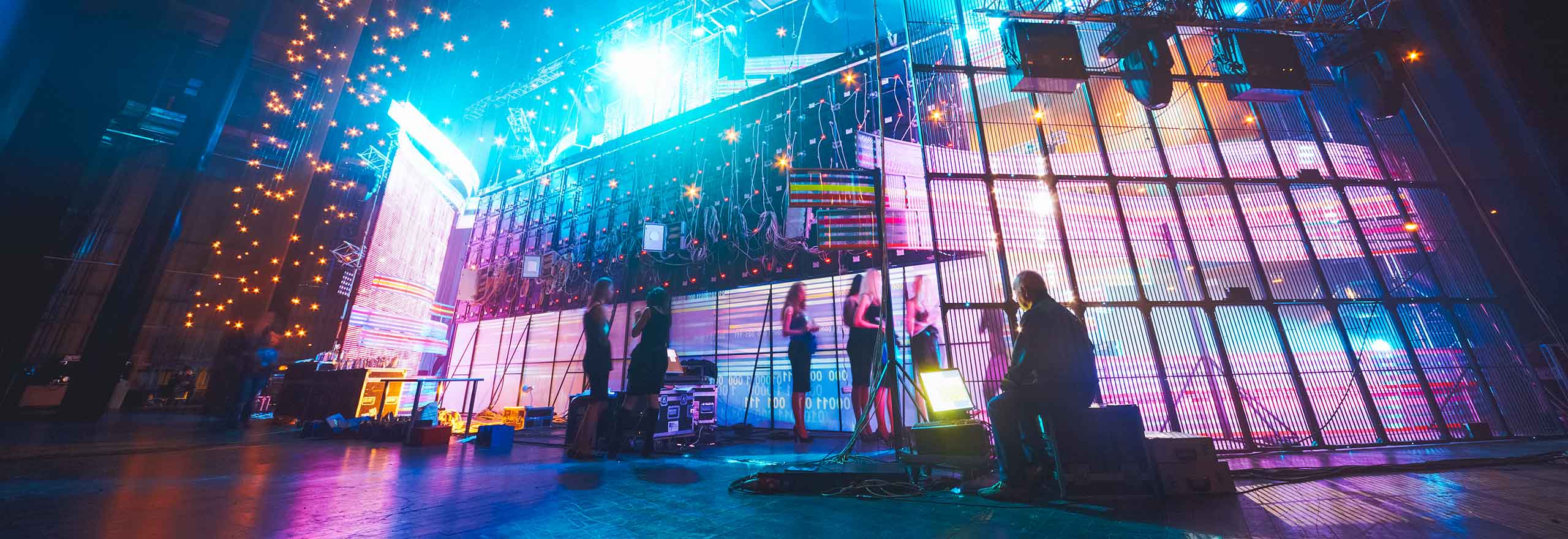 Stylised image of a scene backstage at a formal entertainment event.